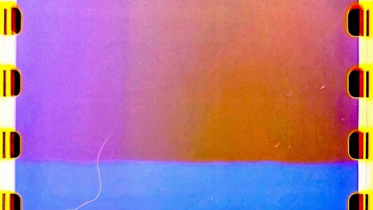 Colorful abstract texture showcasing vibrant filmstrip light leaks.