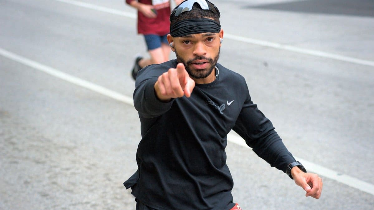 Focused marathon runner in downtown Baltimore participating in a race.