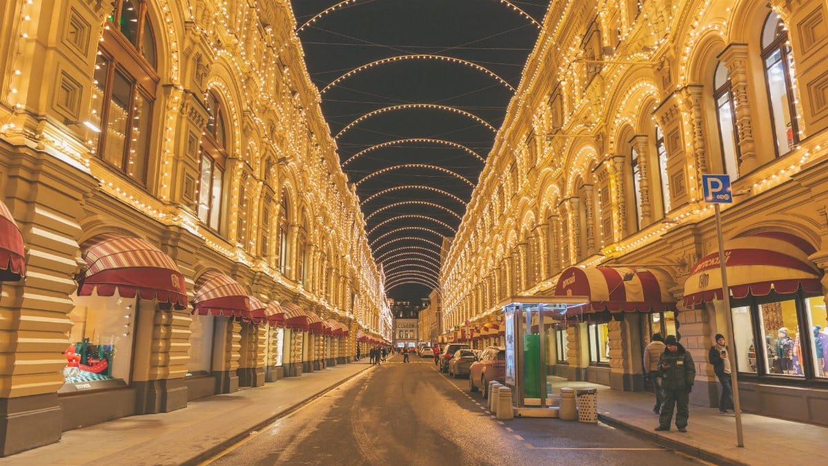 Gorgeous night view of the GUM shopping center in Moscow, adorned with festive lights.