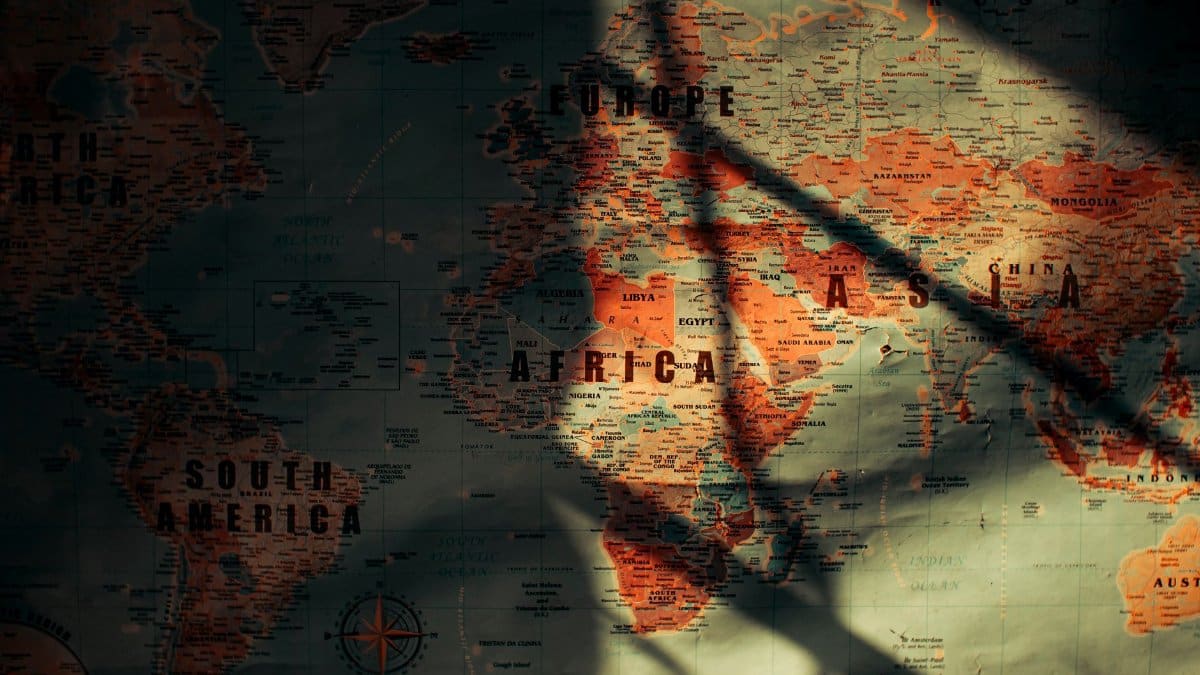 From above of sunlit aged paper world map with continents countries and oceans