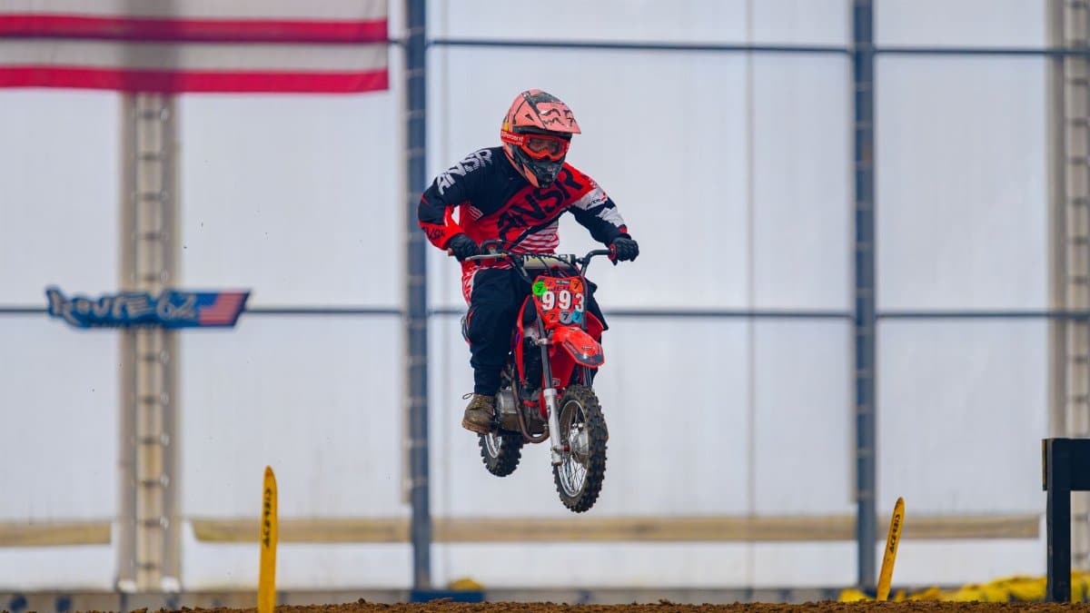 Motocross racer performing a jump at an indoor race in Martinsburg, Ohio. Dynamic and thrilling action.