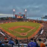 Exciting baseball game at Oracle Park, capturing vibrant crowd and iconic San Francisco skyline.