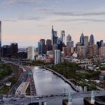 Stunning aerial view of Philadelphia's skyline with iconic skyscrapers and the Schuylkill River during the day.