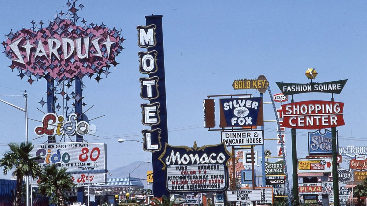 Classic neon signs on the Las Vegas Strip, showcasing retro hotels and casinos.