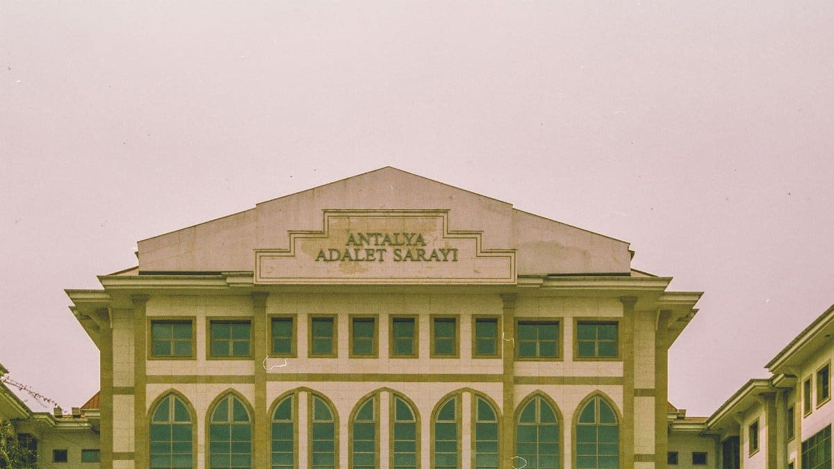 Front view of Antalya Courthouse showcasing its Gothic windows and classical architecture in Antalya, Turkey.