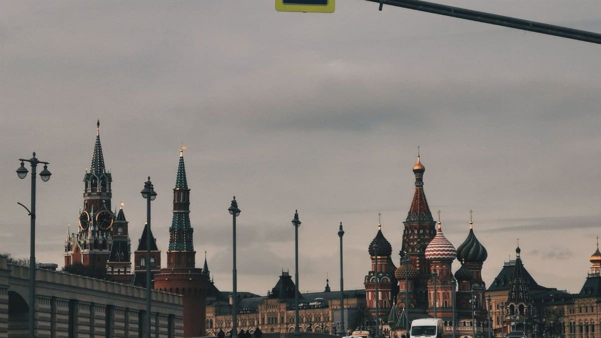 Scenic view of iconic landmarks in Moscow, featuring Kremlin towers and St. Basil's Cathedral.