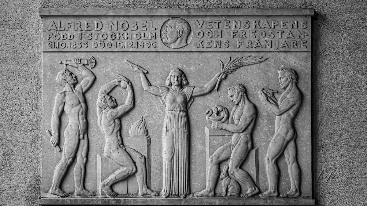 Black and white relief artwork honoring Alfred Nobel in Stockholm City Hall, Sweden.