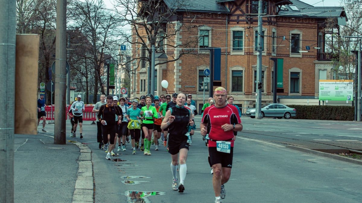 Runners participating in a street marathon in Leipzig, showcasing energy and determination.