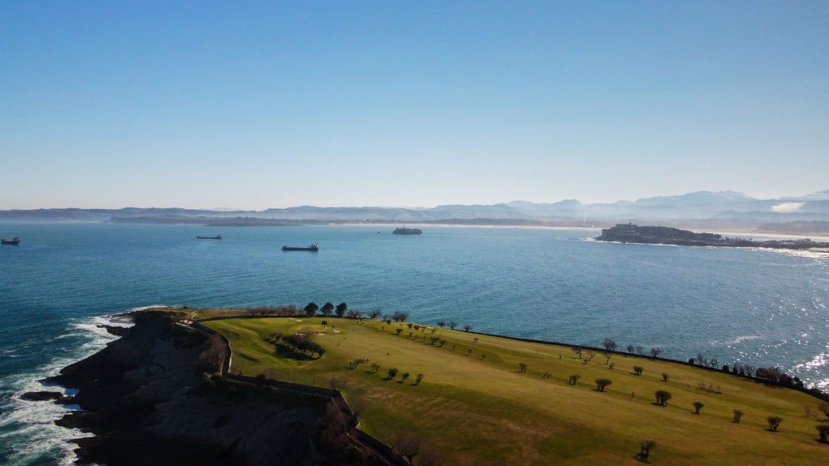Aerial view of the picturesque coastline in Santander, Spain with clear blue sea.