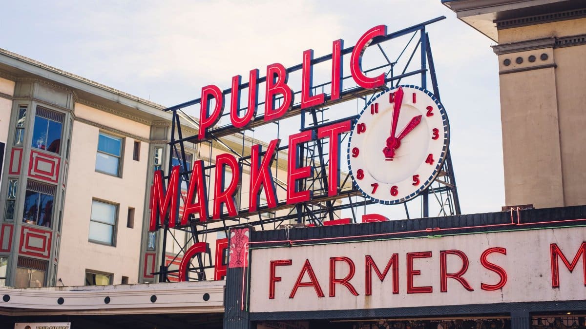 View of the famous Pike Place Market sign in Seattle with the iconic clock tower.