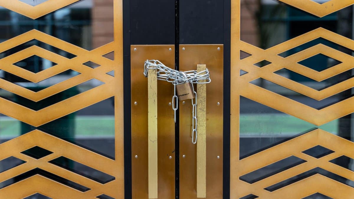 A stylish geometric door locked with a chain, conveying security in Portland.