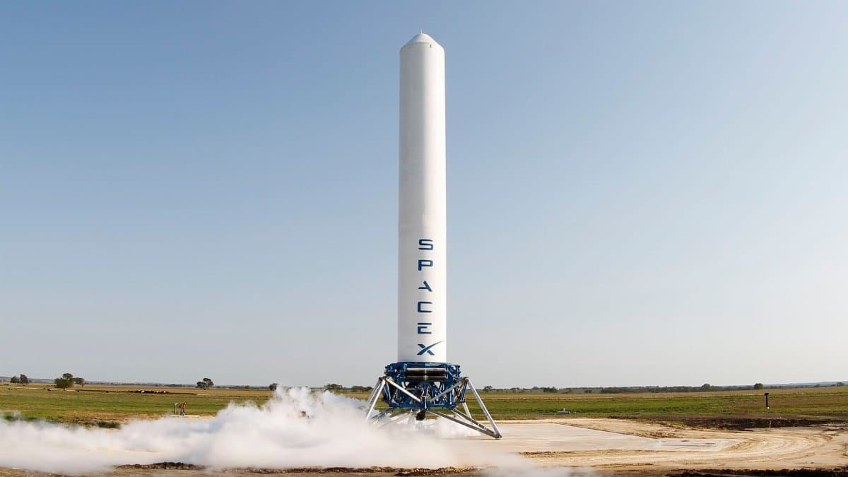 A SpaceX rocket prepares for launch in a rural landscape, capturing a sense of technological advancement.
