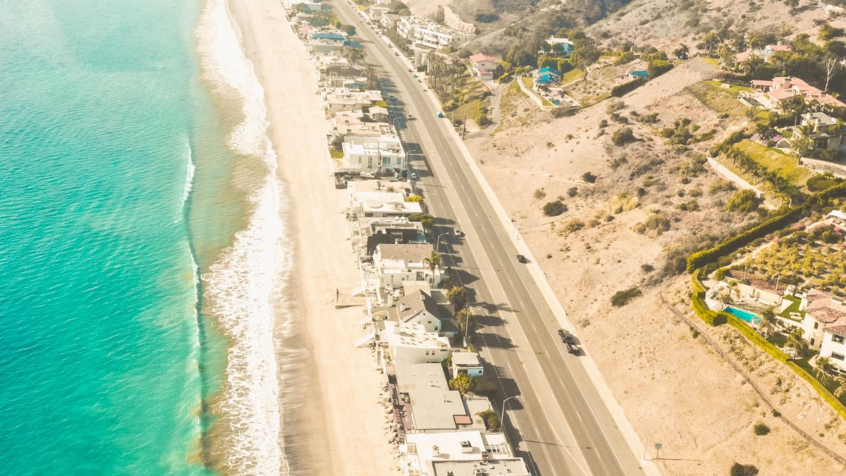 Stunning aerial view of Malibu's coastline and Pacific Highway, showcasing serene landscapes and scenic beauty.