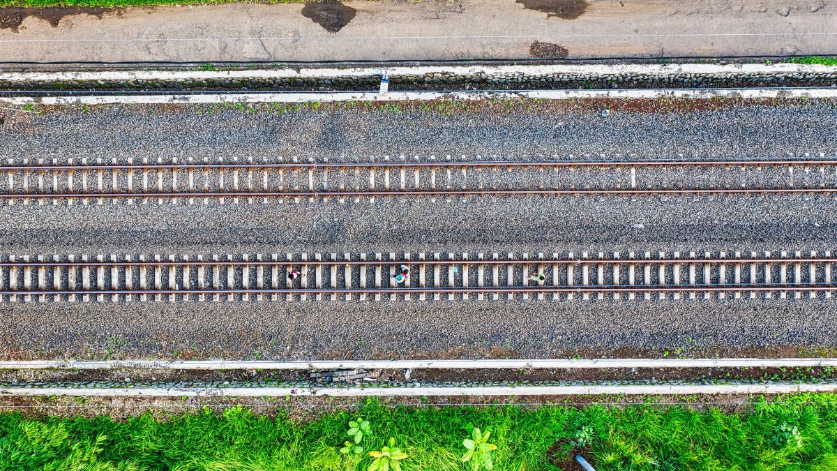 Aerial shot of railway tracks surrounded by greenery in Banten, Indonesia.