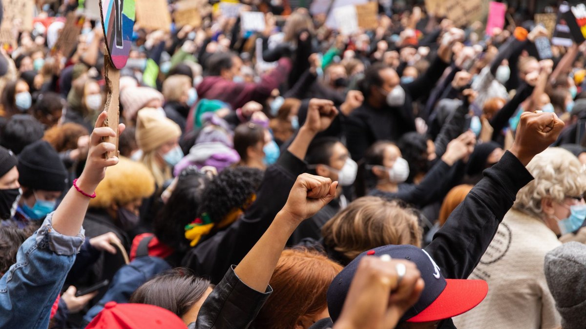 A large group of people in Melbourne protesting for justice and equality.
