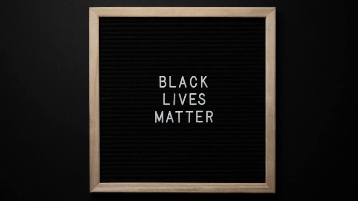 From above of sign Black Lives matter on black square framed signboard on black background