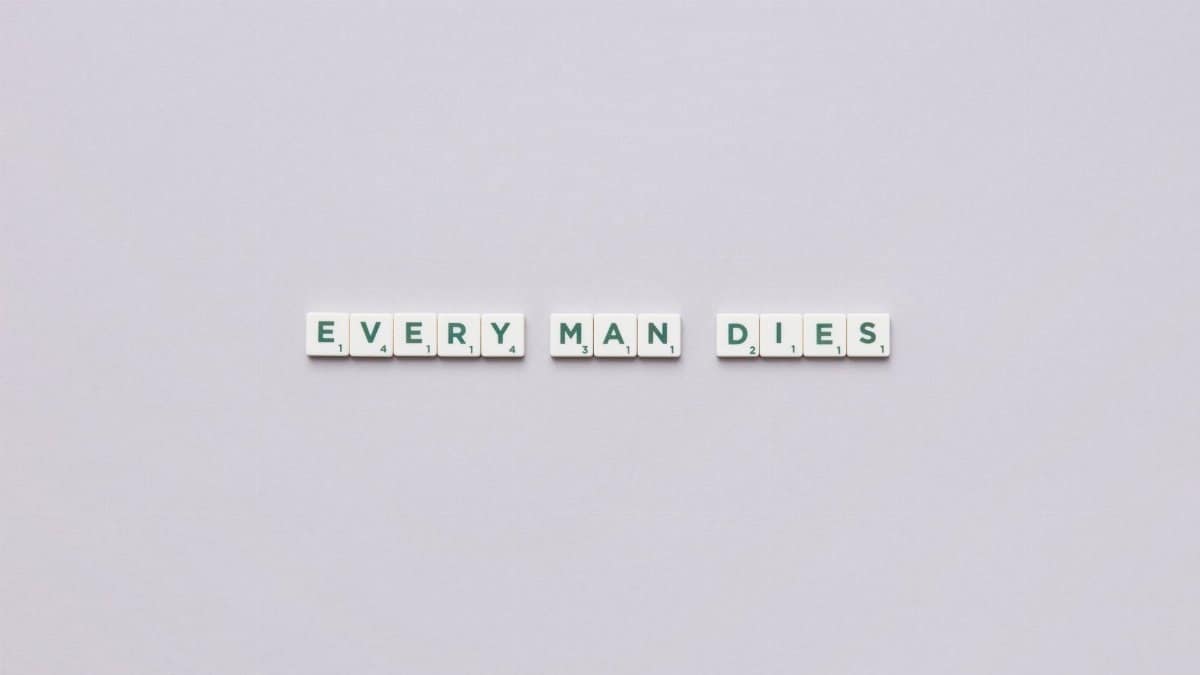 Scrabble letters on a white background forming the phrase 'Every Man Dies.'