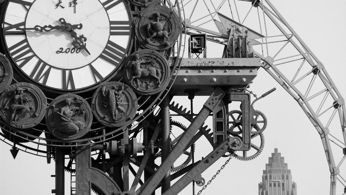 Close-up of Tianjin Century Clock highlighting intricate details in black and white.