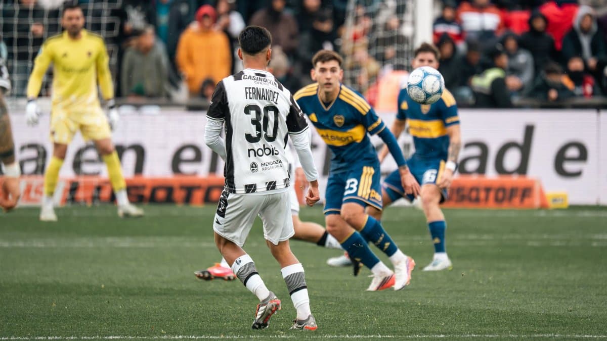 Exciting soccer match scene with players focusing on the ball during a game.