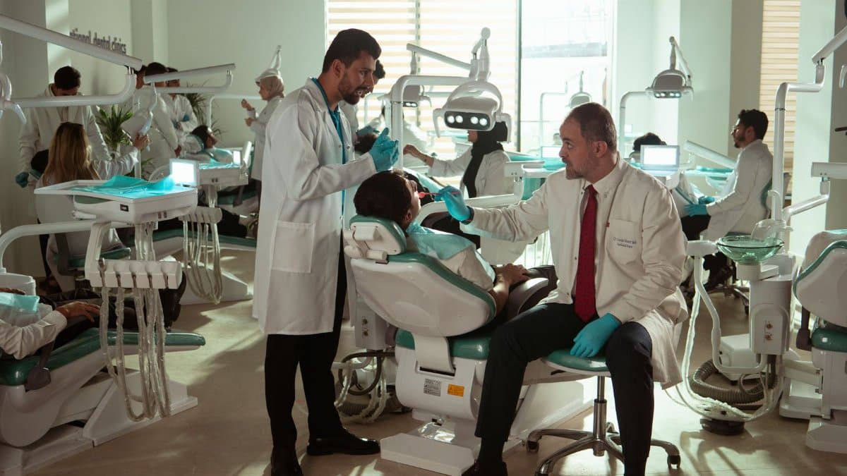 Dental professionals attending to patients in a modern clinic in Baghdad, Iraq.