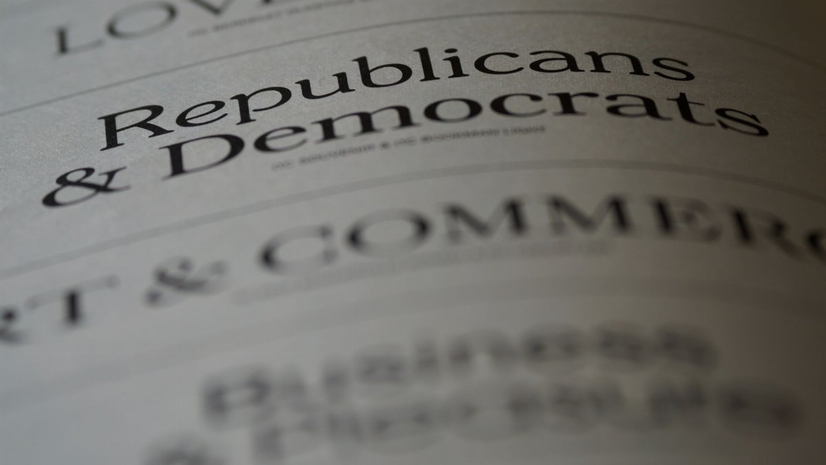 Close-up of blurred text page with 'Republicans & Democrats', focusing on political themes.