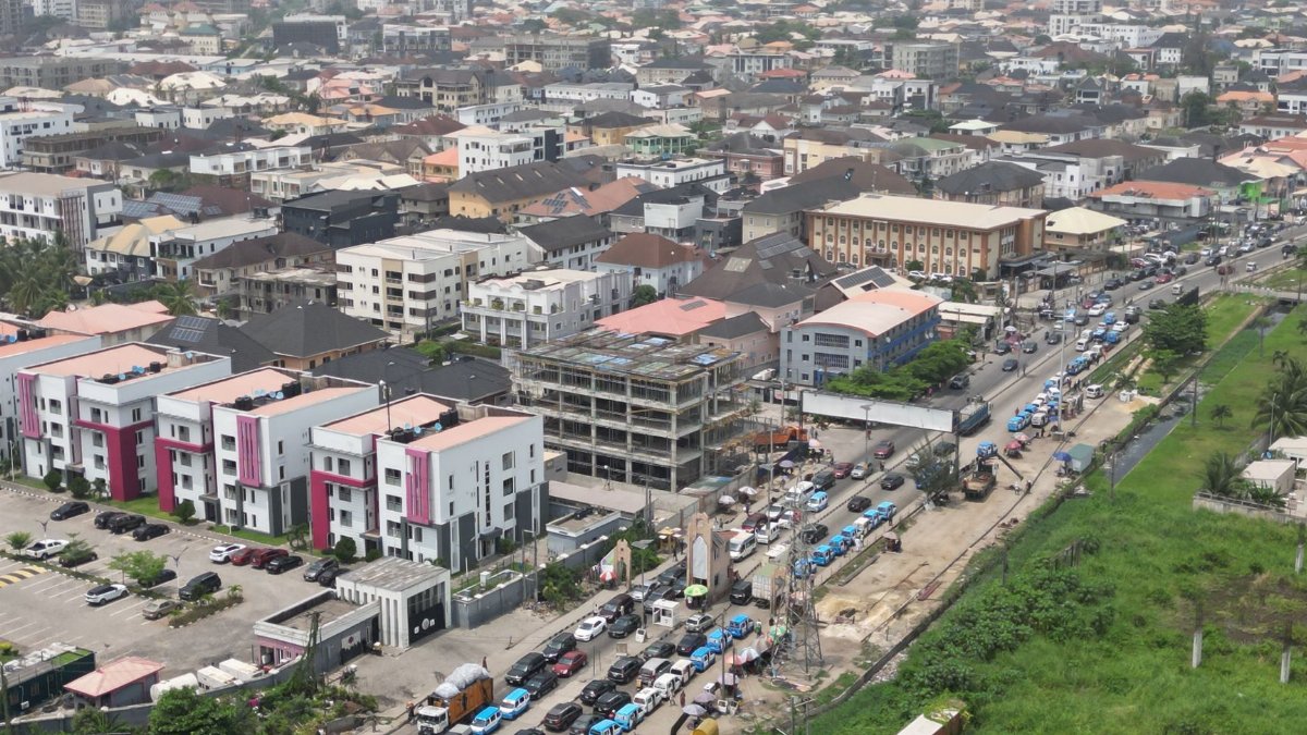 A bustling aerial view of Lagos, Nigeria showcasing dense urban architecture and busy traffic.