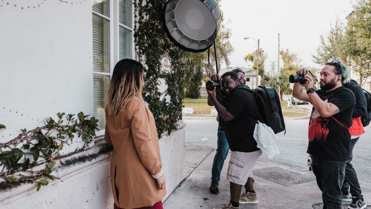 Group of photographers taking portraits of a model in Winter Park, Florida.