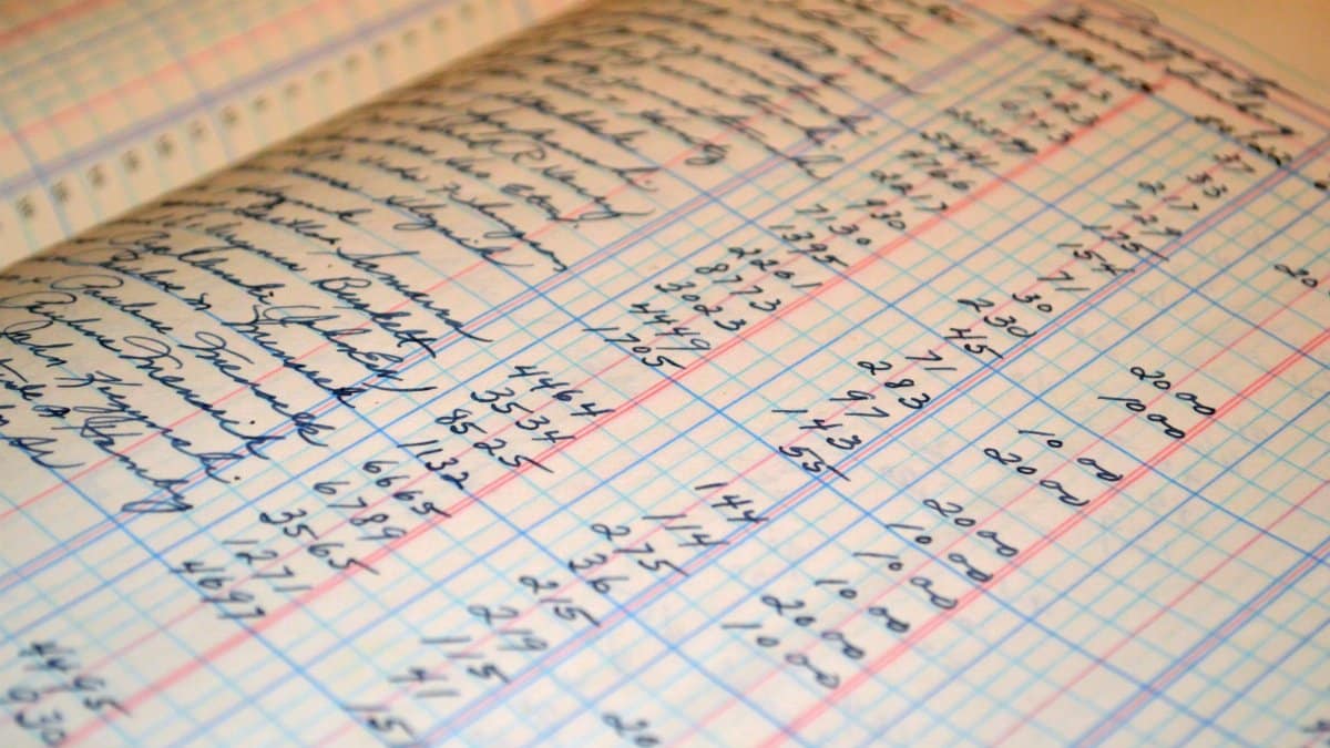 Close-up of a vintage handwritten ledger detailing financial records and accounts.