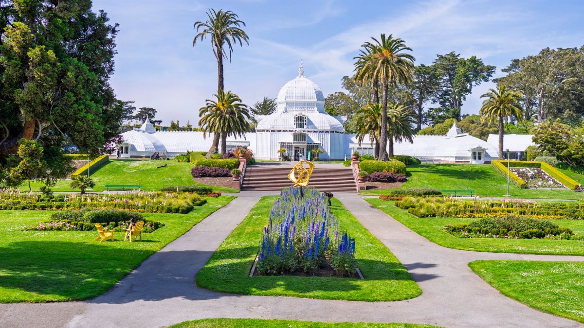 Lush gardens and iconic conservatory at Golden Gate Park, San Francisco.