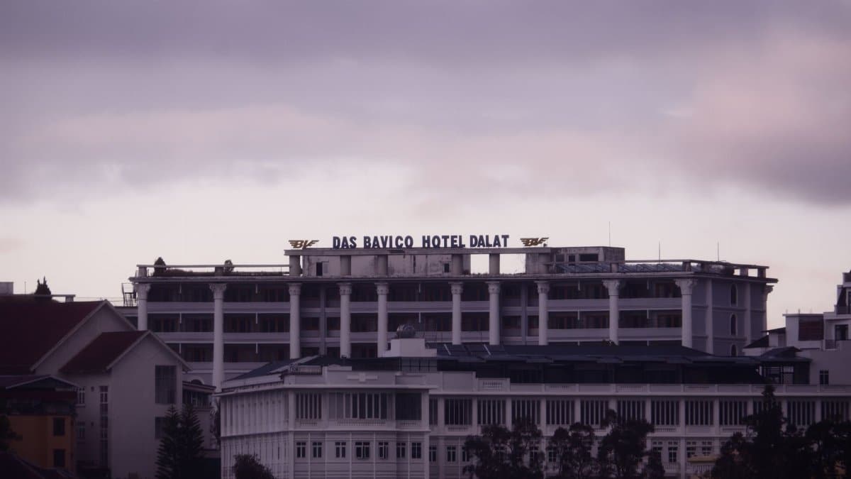 Dramatic view of Das Bavico Hotel in Dalat, Vietnam during twilight.