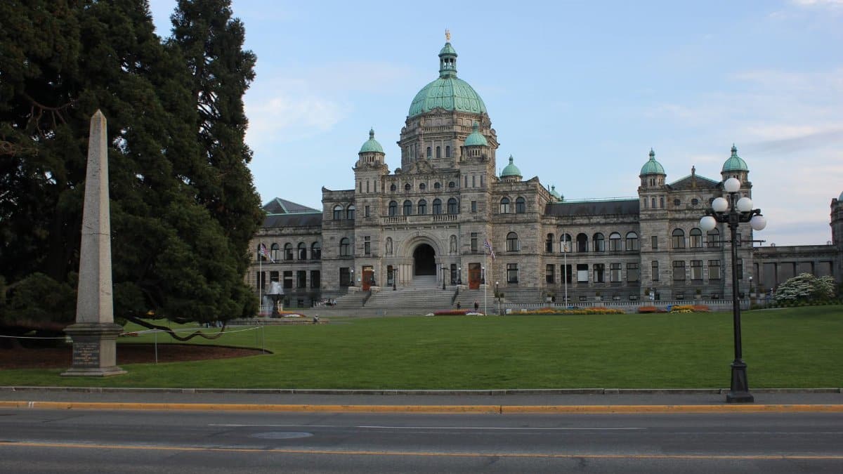 Front view of the British Columbia Parliament Building in Victoria, showcasing its stunning architecture.