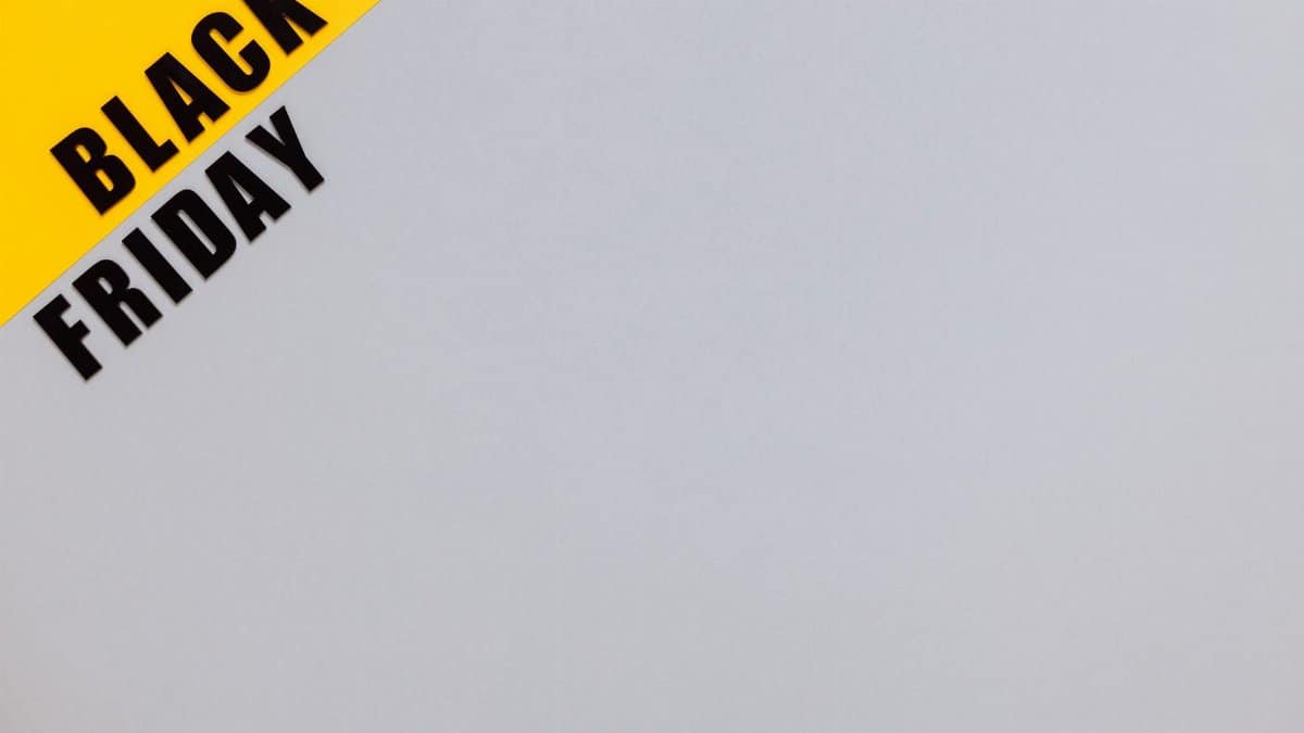 Minimalistic Black Friday banner on yellow and gray background with copy space.