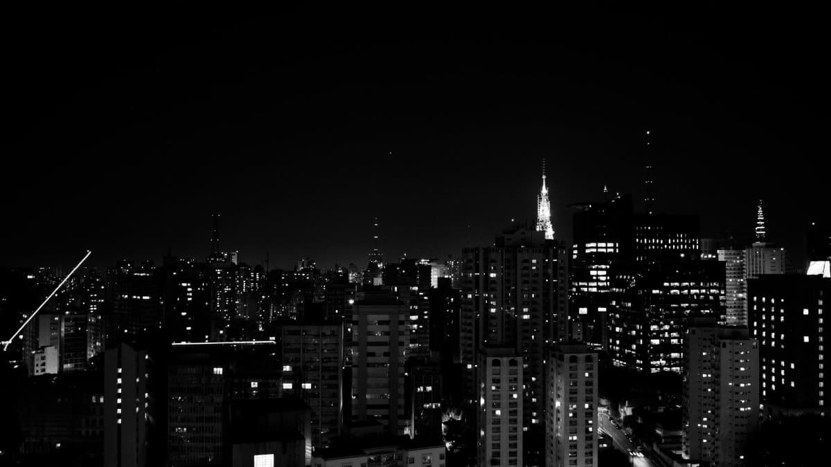 Stunning black and white cityscape of São Paulo at night, showcasing the urban skyline.