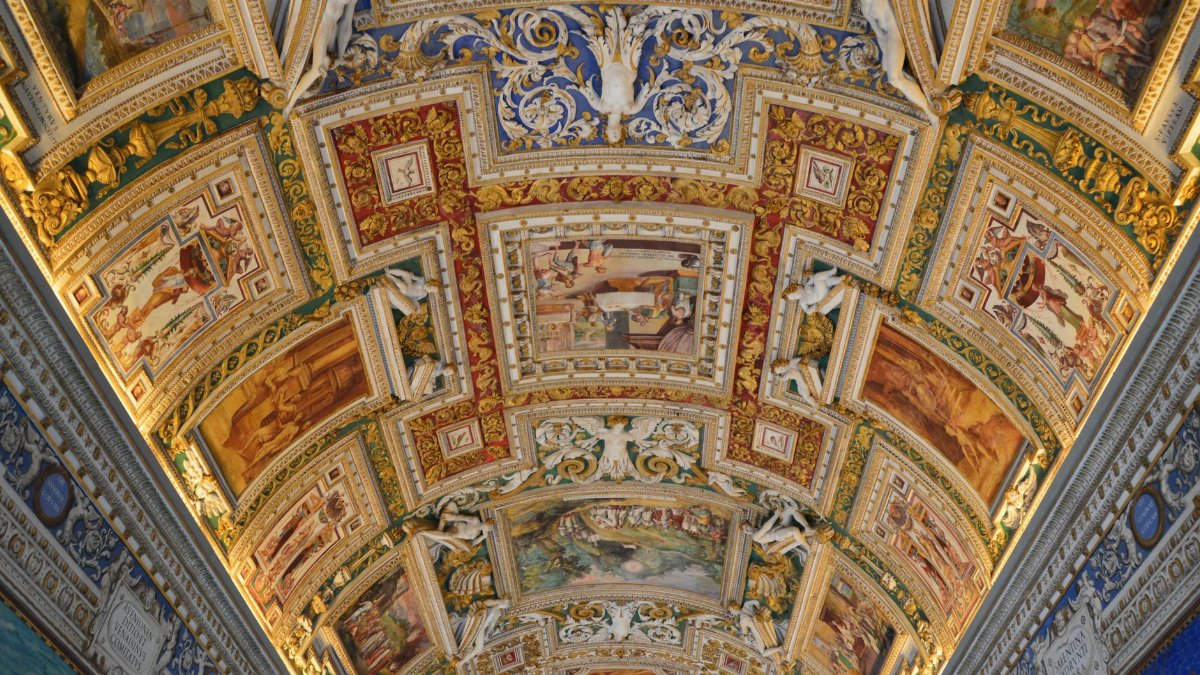Intricately decorated ceiling fresco in the Vatican Museum, Rome, showcasing Renaissance artistry.