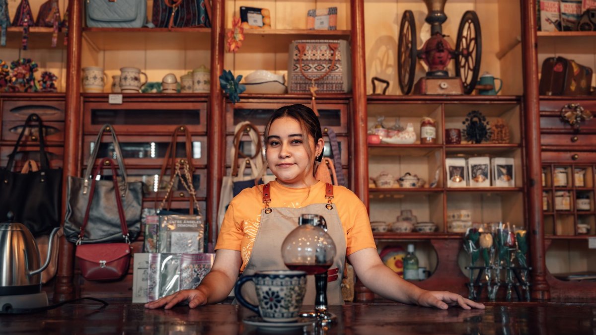Portrait of a young woman standing behind a counter in a traditional Mexican store in Lerma de Villada.