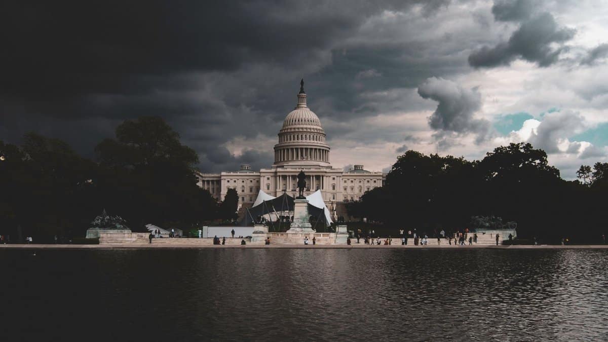 The US Capitol Building against a backdrop of stormy skies in Washington DC.