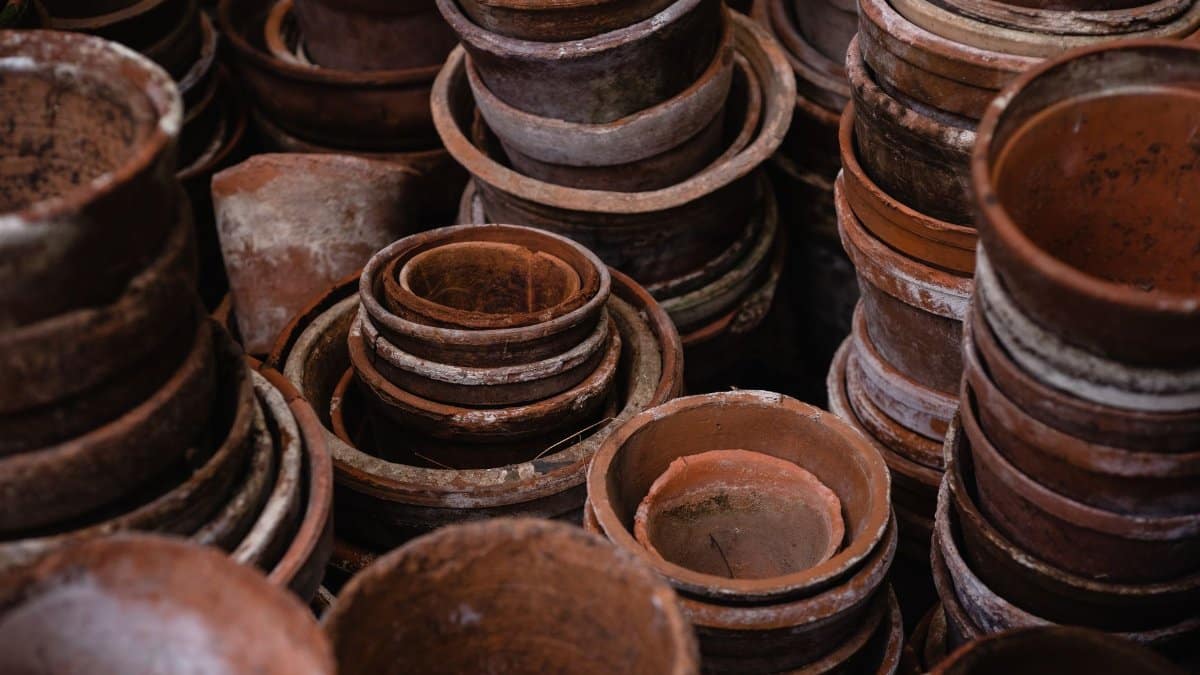 A collection of stacked earthenware pots showcasing rustic craftsmanship and texture.