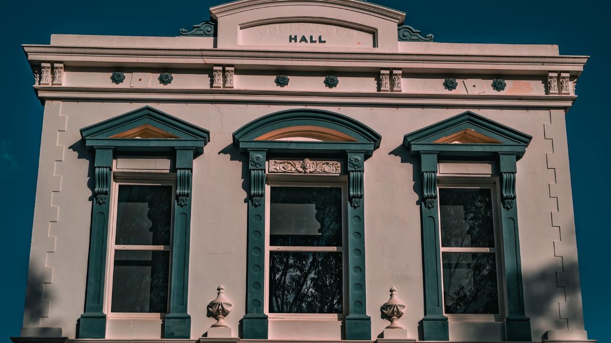 Front view of vintage Town Hall in York, WA, showcasing architectural features.
