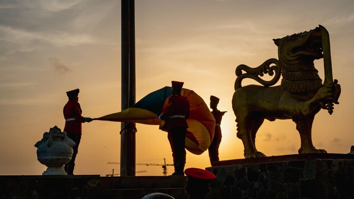 Silhouetted soldiers during a flag-lowering ceremony at sunset in Colombo, Sri Lanka.