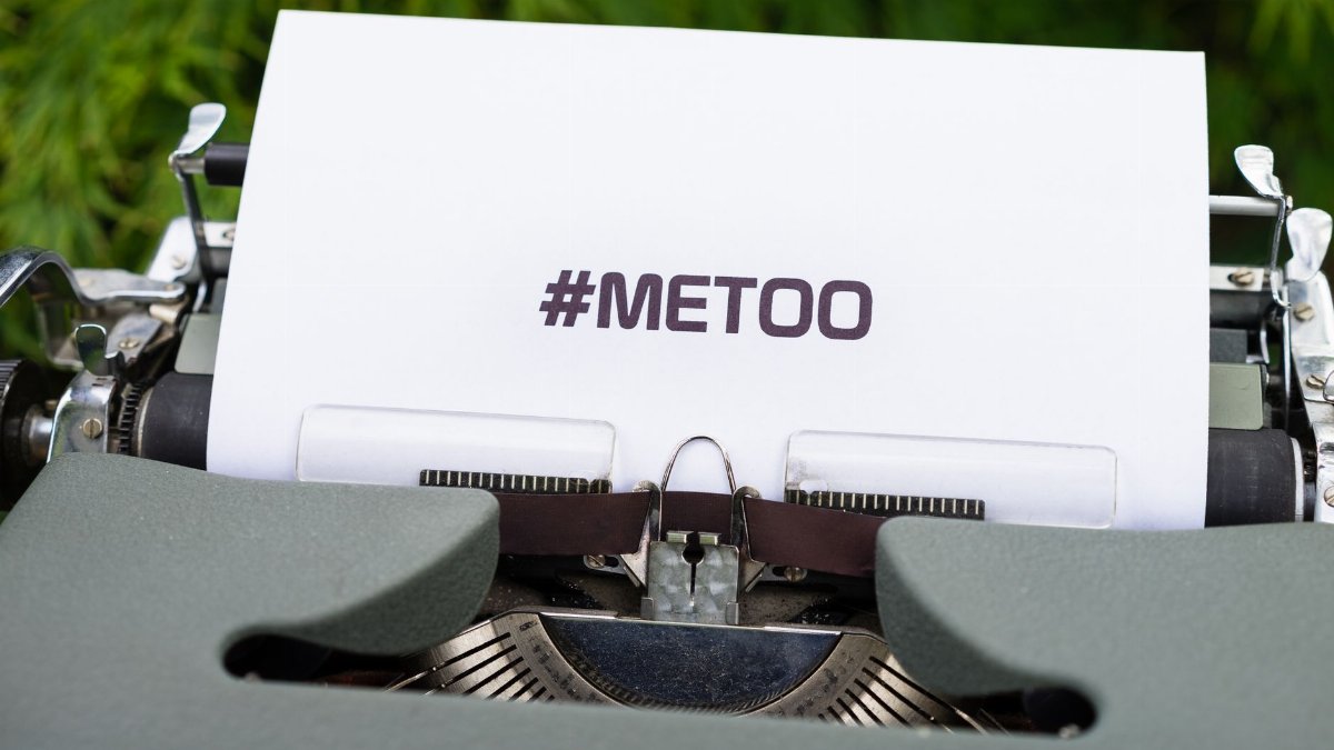 Close-up of a typewriter with the #MeToo message, symbolizing the movement for social justice.
