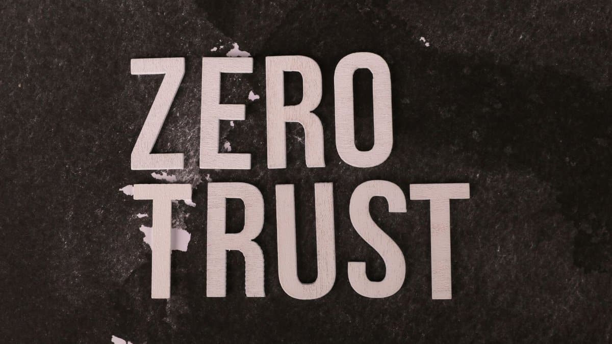 Wooden text reading 'Zero Trust' on a black textured background emphasizing security.