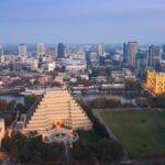 Stunning aerial view of Sacramento, California skyline with the iconic Tower Bridge at dusk.