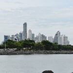 A scenic view of Panama City skyline captured from the waterfront, highlighting modern skyscrapers.