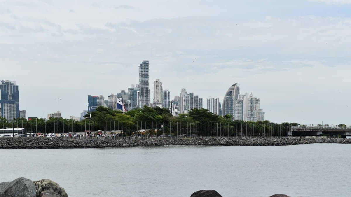 A scenic view of Panama City skyline captured from the waterfront, highlighting modern skyscrapers.