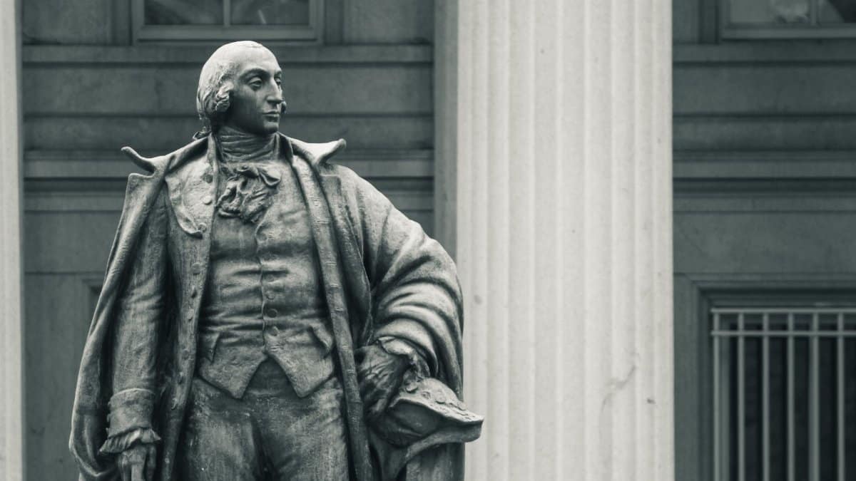 Monochrome photo of a historical statue in Washington D.C., highlighting its classical architecture.
