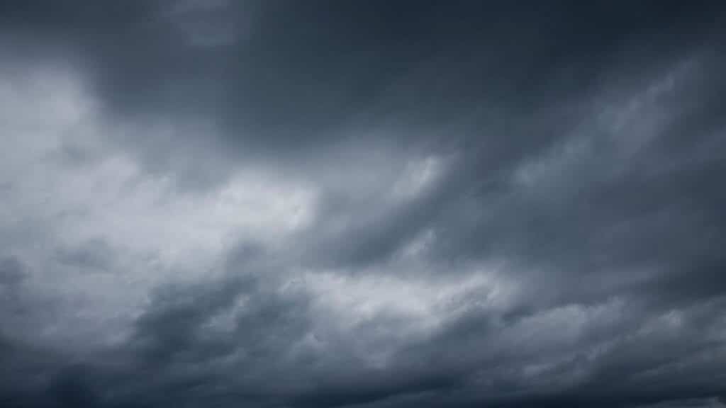 Dark and moody sky filled with stormy, overcast clouds, signaling incoming rain or storm.