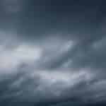 Dark and moody sky filled with stormy, overcast clouds, signaling incoming rain or storm.