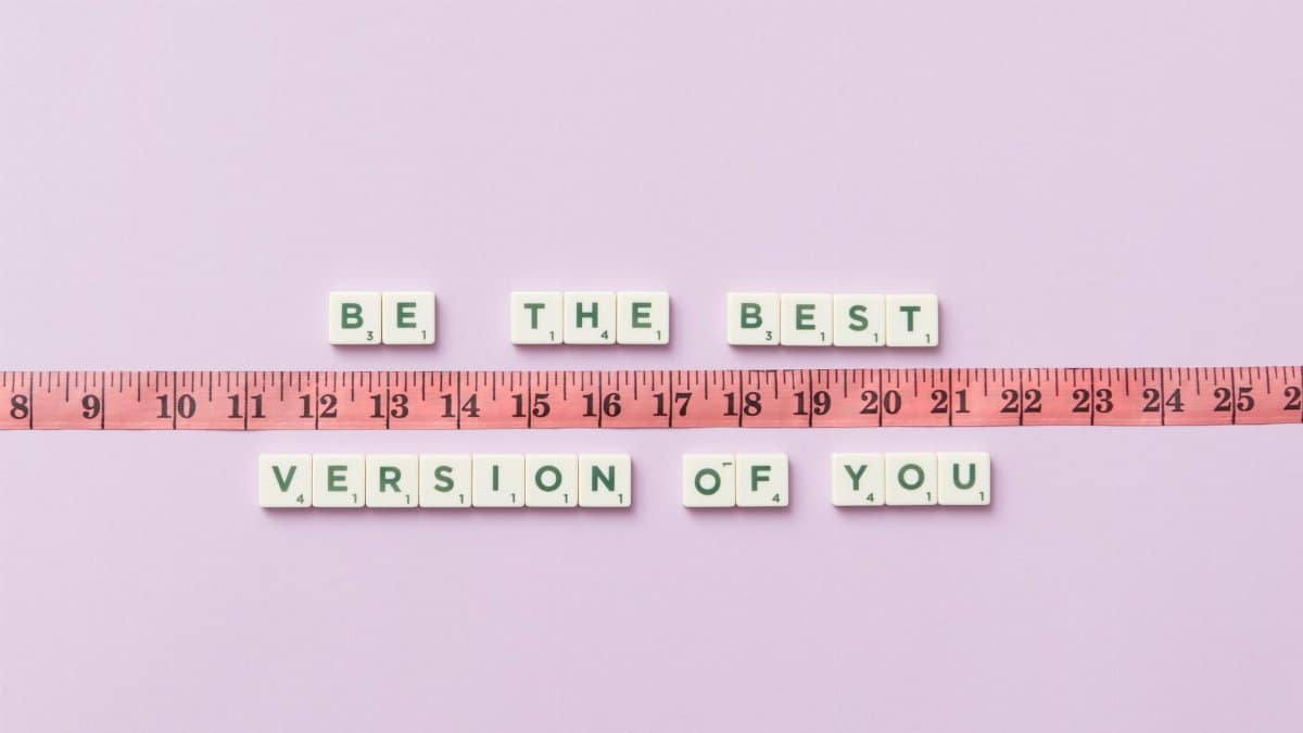 Motivational phrase 'Be the Best Version of You' with a measuring tape on purple background.