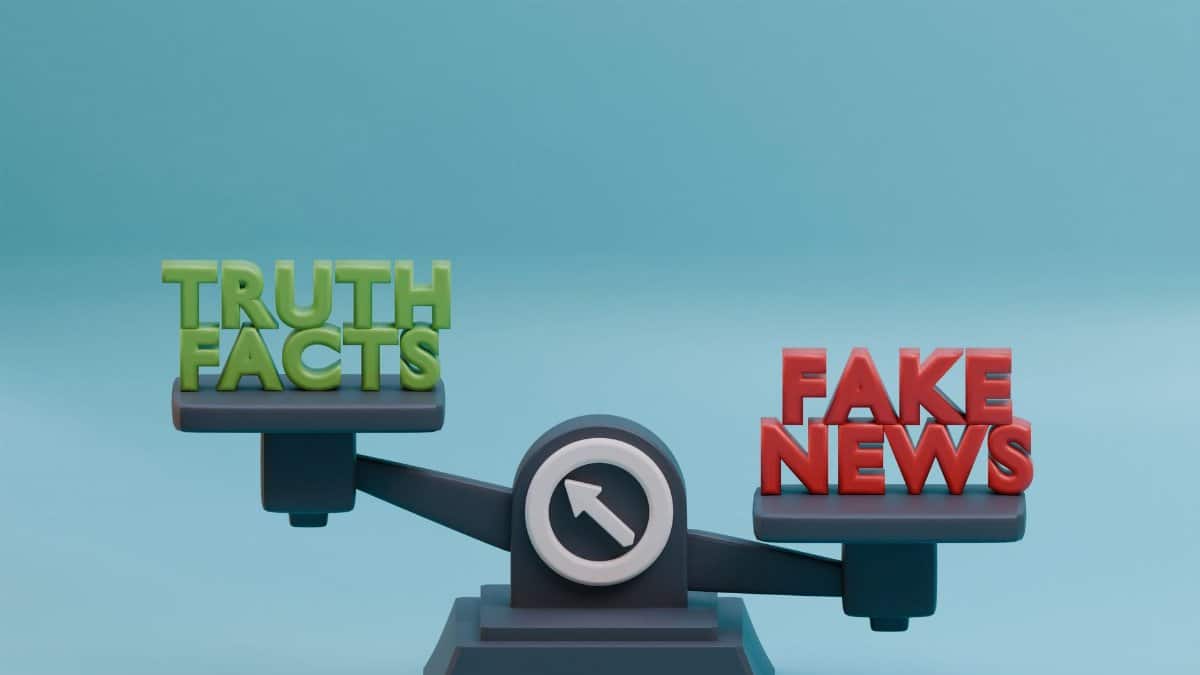 3D illustration of a scale balancing truth and fake news concept against a blue background.