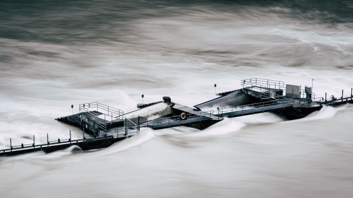 An aerial view of a structure overwhelmed by a river flood in Bern, Switzerland.